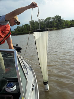 Nebraska Invasive Species Project Technician Garrett Hanquest sampling reservoirs, July 2011. (Karie Decker/Nebraska Invasive Species Project)